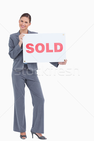 Felice agente immobiliare venduto segno bianco donna Foto d'archivio © wavebreak_media