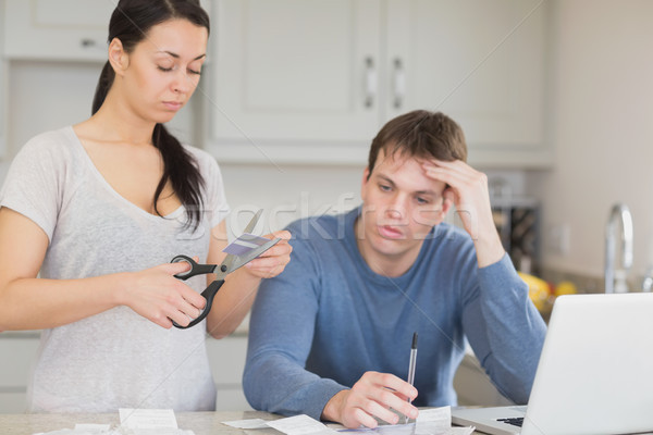 Two people working on finances and cut through the credit card Stock photo © wavebreak_media