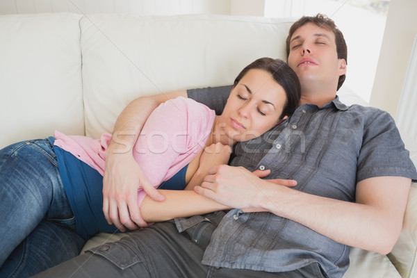 Young couple sleeping on the couch in the living room Stock photo © wavebreak_media