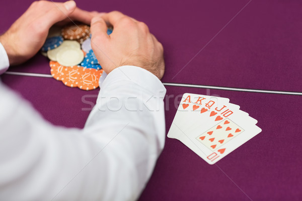 Man winning at poker with royal flush in casino Stock photo © wavebreak_media
