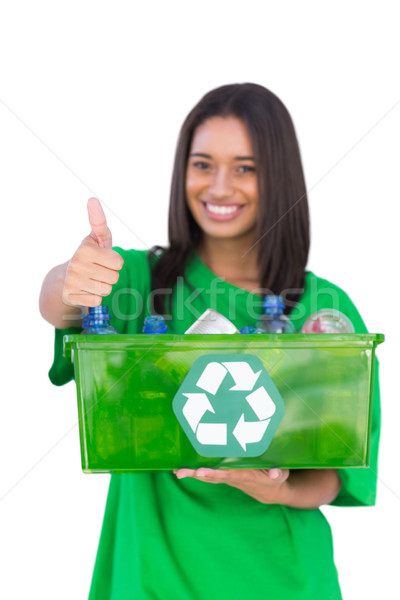 Enivromental activist holding box of recyclables and giving thum Stock photo © wavebreak_media