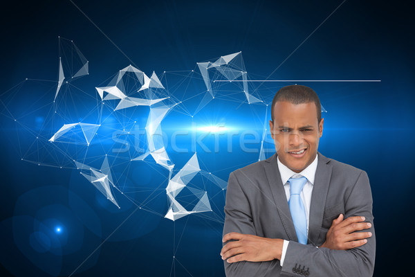 Composite image of doubtful young businessman with arms crossed Stock photo © wavebreak_media