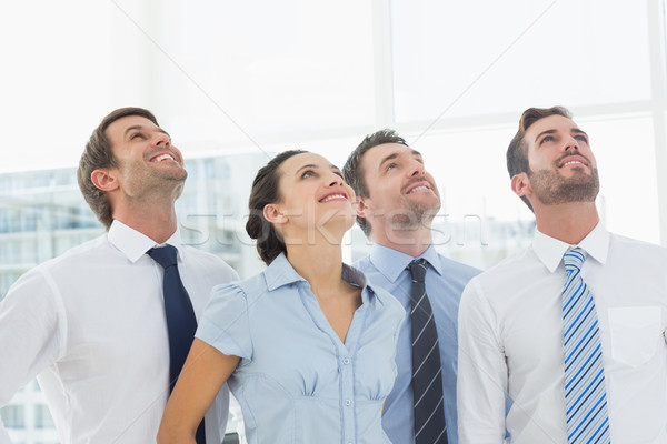 Smiling business team looking up Stock photo © wavebreak_media