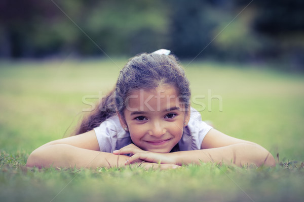 Smiling little girl looking at the camera Stock photo © wavebreak_media