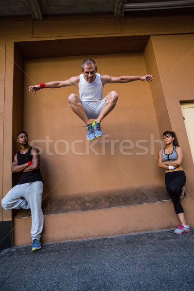 Group of people doing parkour in the city Stock photo © wavebreak_media