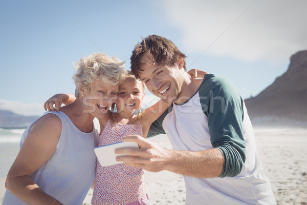 Happy multi-generated family taking selfie at beach Stock photo © wavebreak_media