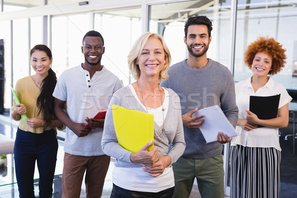 Portrait of smiling business people holding files Stock photo © wavebreak_media