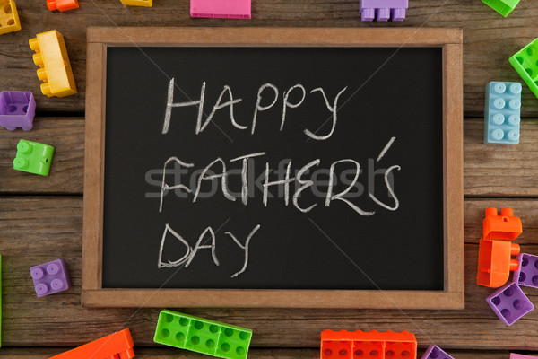 Stock photo: Happy fathers day message written on slate