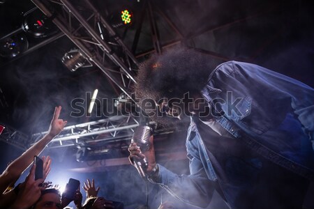 Male musician playing piano in illuminated nightclub Stock photo © wavebreak_media