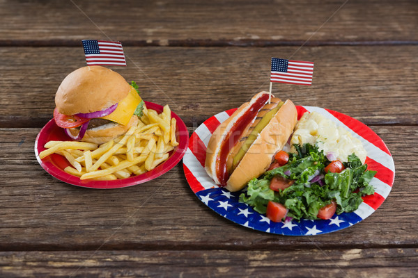 Burger and hot dog on wooden table with 4th july theme Stock photo © wavebreak_media