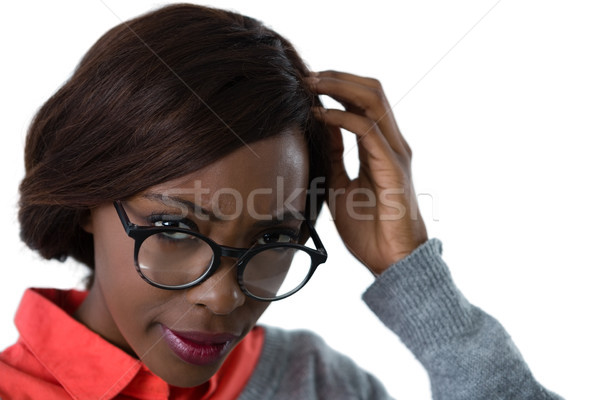 Close up of confused young woman wearing eyeglasses Stock photo © wavebreak_media