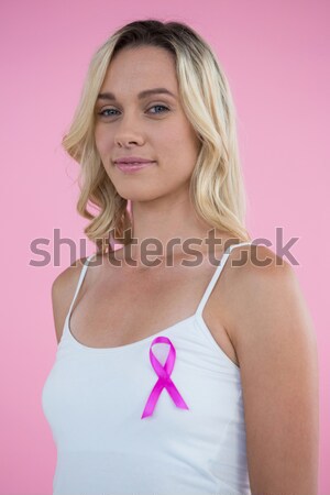 Close up of woman in pink bra with Breast Cancer Awareness ribbon Stock photo © wavebreak_media