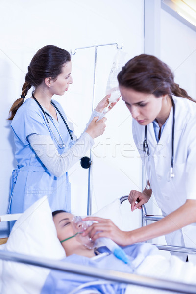 Doctors putting an oxygen mask on patient Stock photo © wavebreak_media