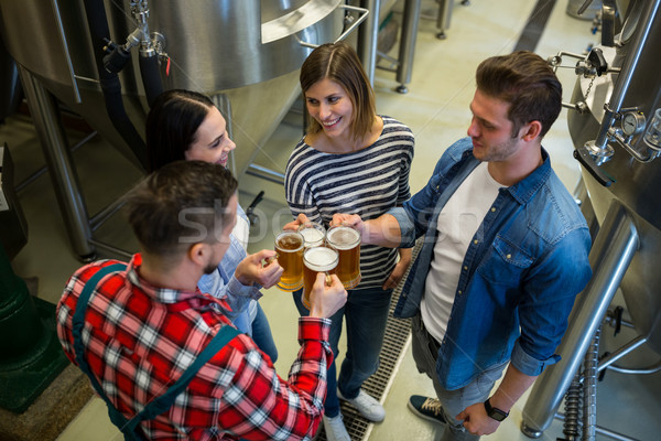 Brewers toasting beers at brewery Stock photo © wavebreak_media