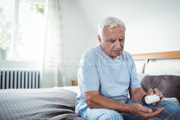 Senior man taking medicines Stock photo © wavebreak_media