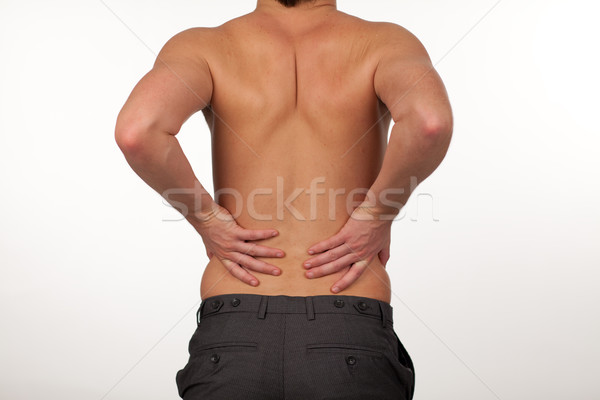 Man with backpain isolated agasint white Stock photo © wavebreak_media