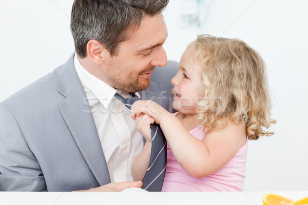 Little girl adjusting the tie of her father Stock photo © wavebreak_media
