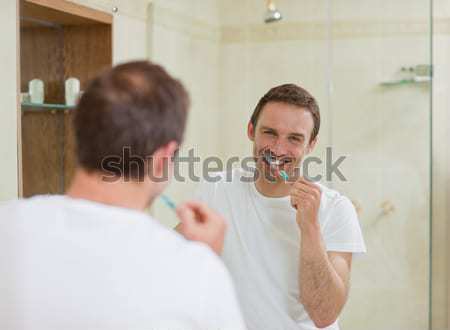 Man brushing his teeth Stock photo © wavebreak_media