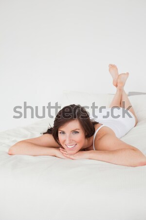 Portrait femme posant lit sourire sexy [[stock_photo]] © wavebreak_media