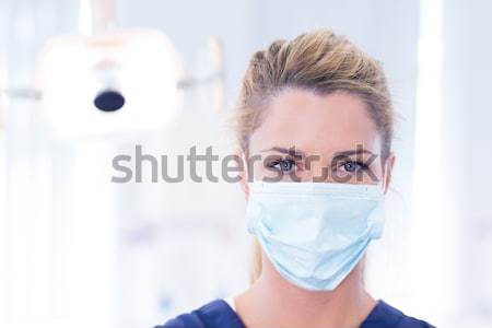 Good looking woman pouring liquid in a tube in a laboratory Stock photo © wavebreak_media