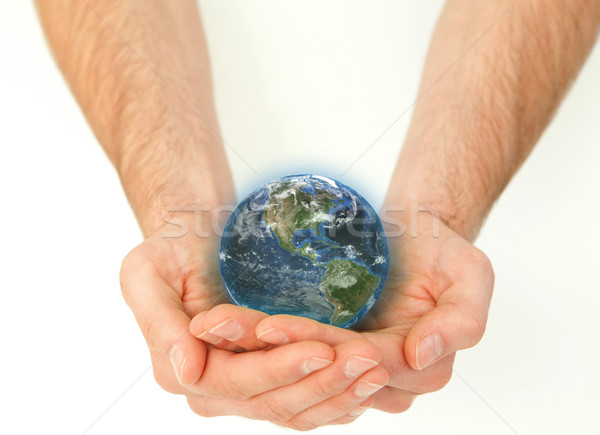 Masculine hands holding a planet globe against a white background Stock photo © wavebreak_media