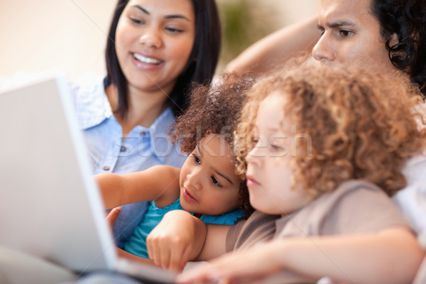Young family having a good time at the laptop together Stock photo © wavebreak_media