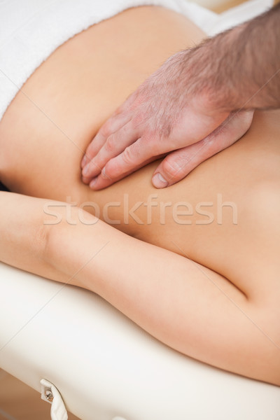 Close-up of a therapist massaging a woman indoors Stock photo © wavebreak_media