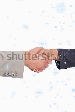 Handcuffed business people shaking hands Stock photo © wavebreak_media