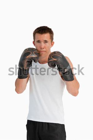 Portrait of young man in boxing stance Stock photo © wavebreak_media