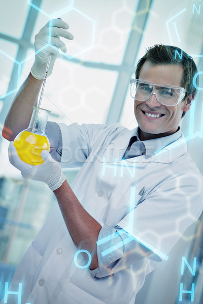 Composite image of young scientist working with a beaker Stock photo © wavebreak_media