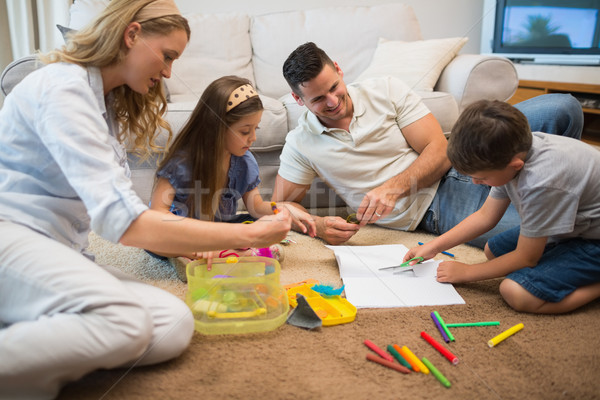 Family assisting boy in drawing Stock photo © wavebreak_media