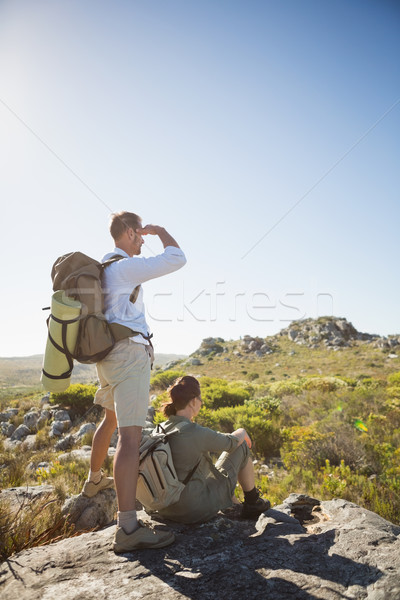 Hiking couple looking out over mountain terrain Stock photo © wavebreak_media