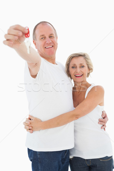 Maturité couple souriant caméra clé [[stock_photo]] © wavebreak_media