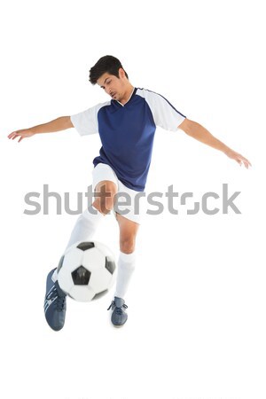 Football player in blue standing with the ball Stock photo © wavebreak_media