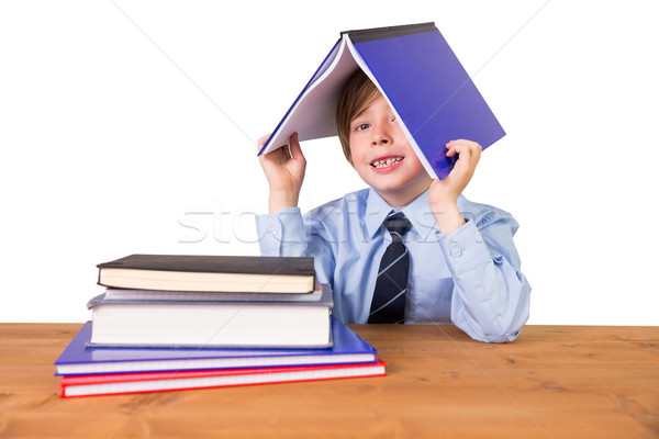 Student covering head with book Stock photo © wavebreak_media
