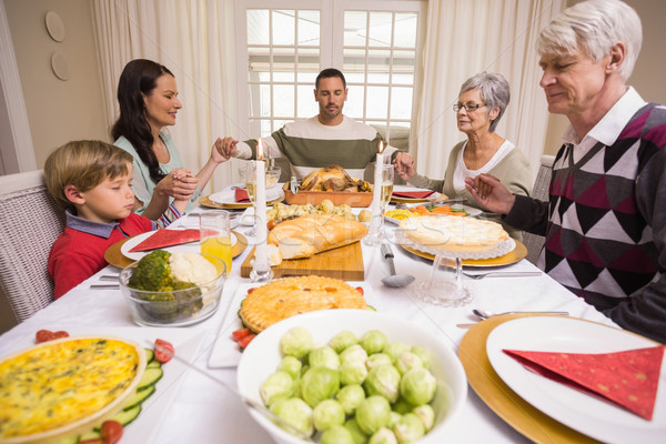 Großfamilie Sprichwort Weihnachten Abendessen home Wohnzimmer Stock foto © wavebreak_media