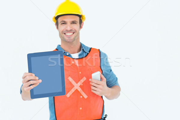 Carpenter holding digital tablet and mobile phone Stock photo © wavebreak_media