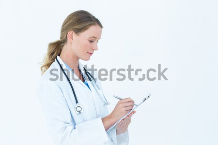 Happy doctor using her tablet pc Stock photo © wavebreak_media