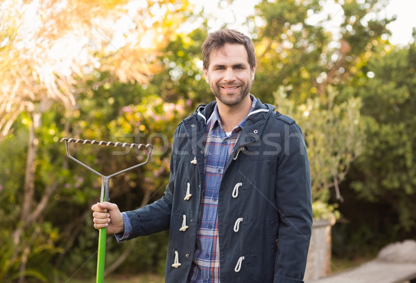 Man raking in his garden Stock photo © wavebreak_media