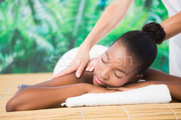 Pretty woman enjoying a back massage Stock photo © wavebreak_media