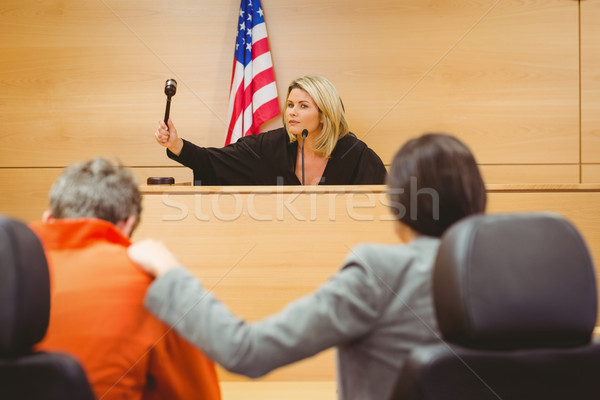 Stock photo: Judge about to bang gavel on sounding block