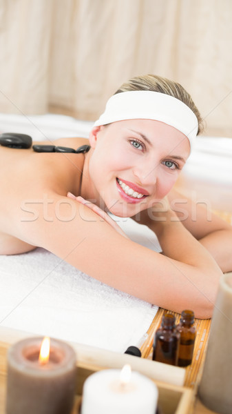 Beautiful blonde enjoying a hot stone massage  Stock photo © wavebreak_media