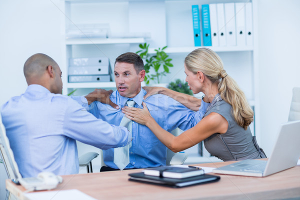 Business partners fighting together Stock photo © wavebreak_media