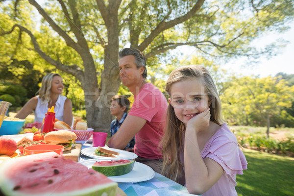 Fille séance table repas famille parc [[stock_photo]] © wavebreak_media