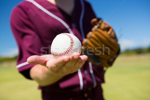 MId section of baseball pitcher holding ball on palm Stock photo © wavebreak_media