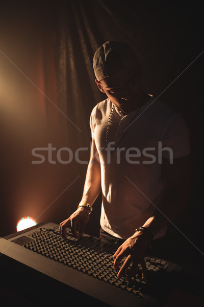 Male DJ operating sound mixer at music concert Stock photo © wavebreak_media