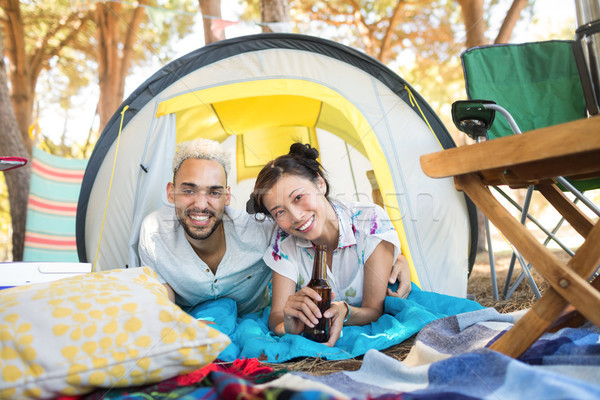 Porträt lächelnd Paar entspannenden Zelt Campingplatz Stock foto © wavebreak_media