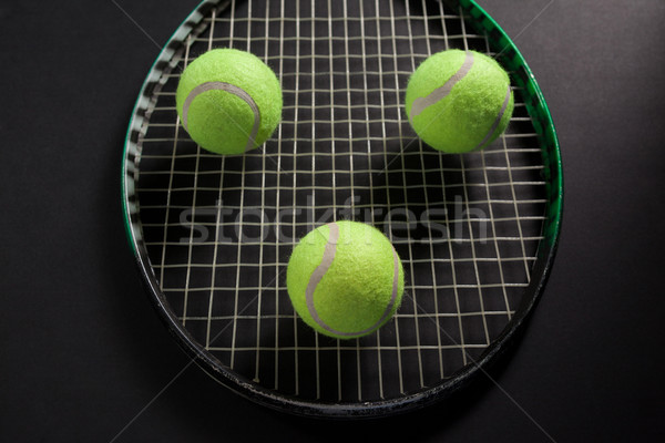 High angle view of balls on tennis racket Stock photo © wavebreak_media