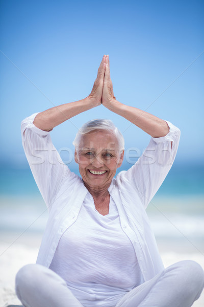 Beautiful mature woman posing with hands joined Stock photo © wavebreak_media