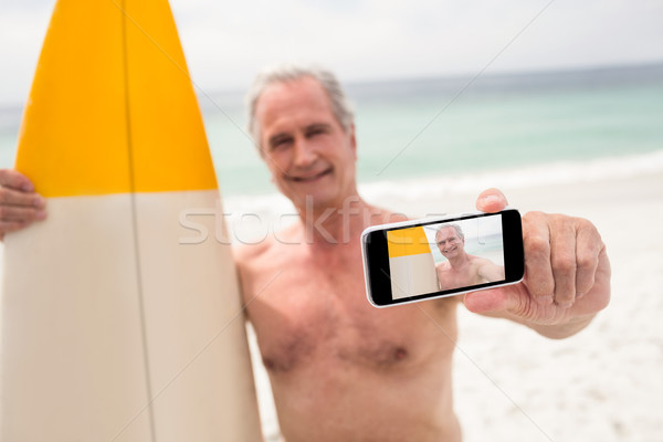 Supérieurs homme planche de surf téléphone portable plage [[stock_photo]] © wavebreak_media